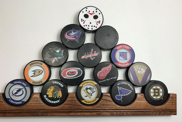 Fifteen Hockey Pucks
