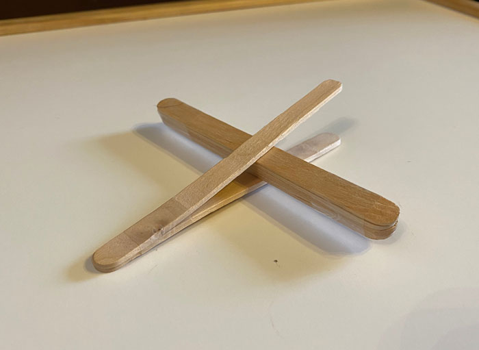 Two Popsicle Sticks Placed End to End